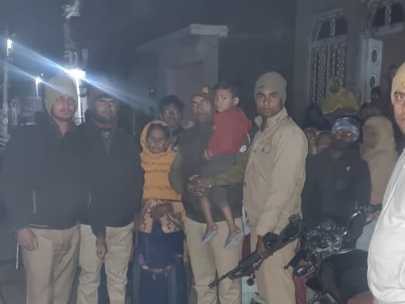 The faces of the family members were happy after seeing the child, after coming from school, he had gone somewhere from home.  The family members were happy after getting the child, after coming from school, he had gone somewhere from home.