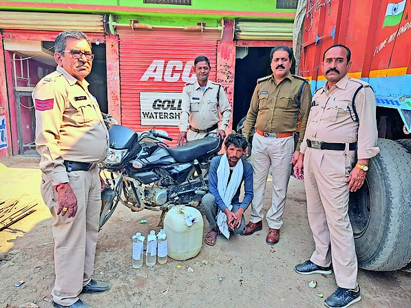 Accused arrested with 20 liters of raw liquor.  Accused arrested with 20 liters of raw liquor